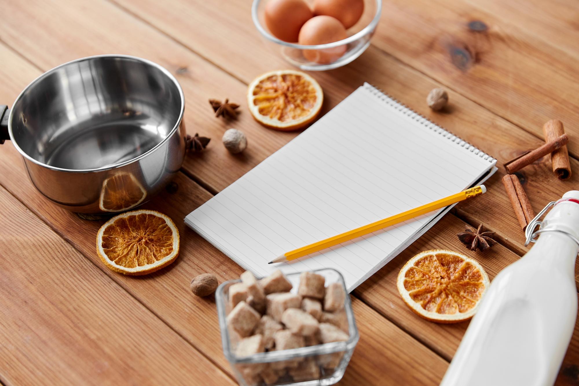 Small commercial kitchen counter with ingredients and notebooks