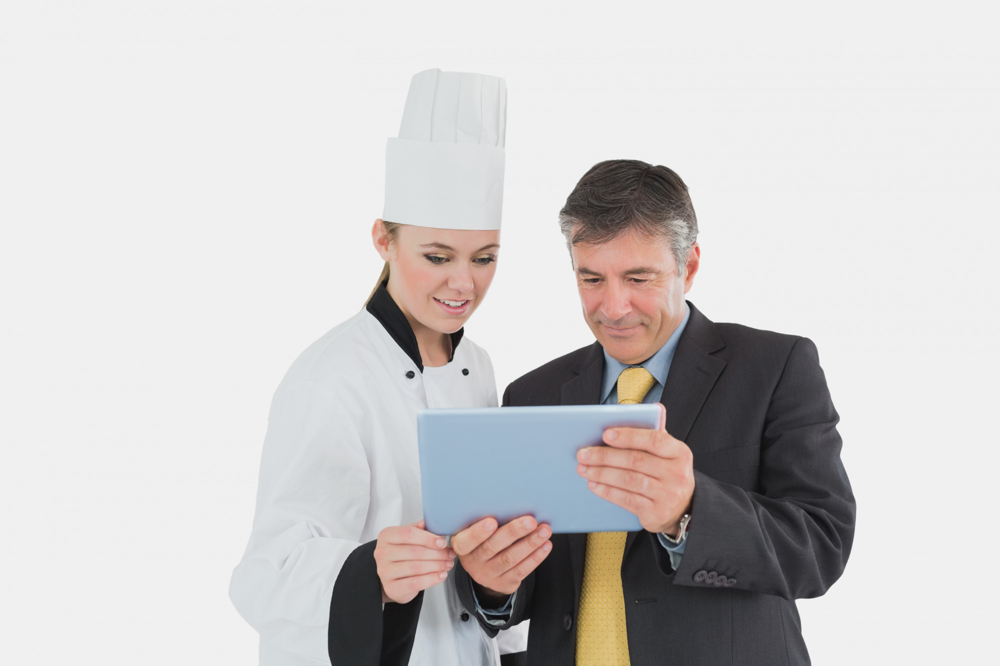 Consultation meeting in kitchen with papers and tablet